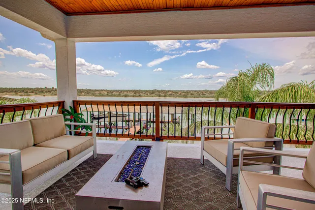 a view of a chairs and table in patio