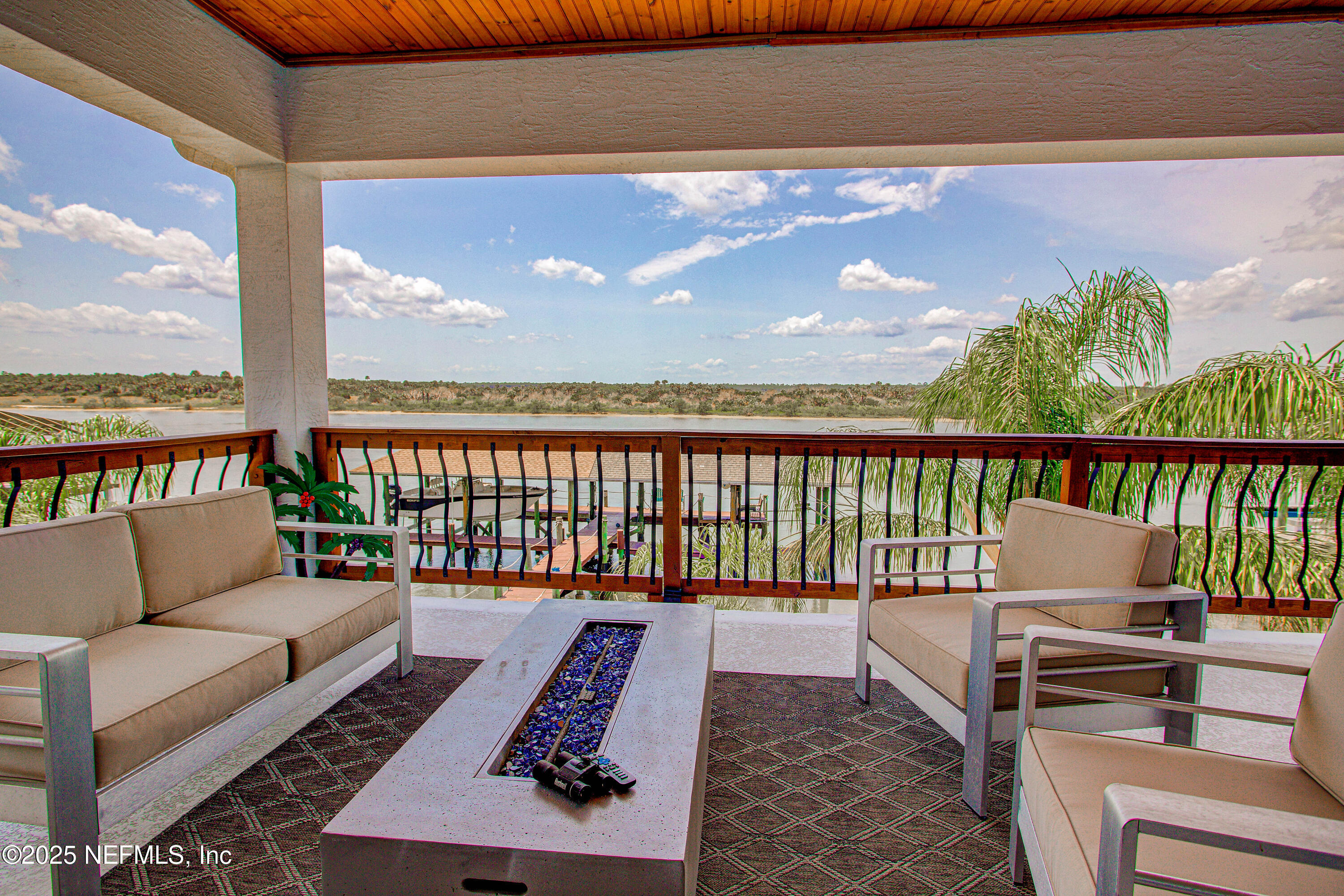 9155 June Lane St. Augustine, FL 32080 - Photo 35 of 43 a balcony with furniture and a potted plant