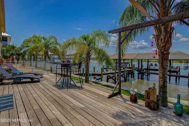 a view of a swimming pool with a table and chairs