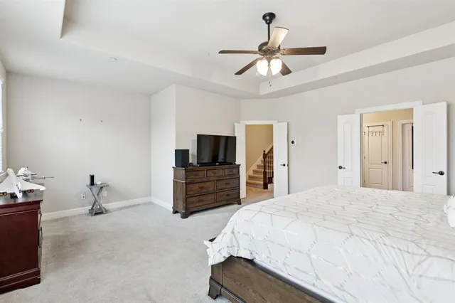 a bathroom with a tub a sink and mirror