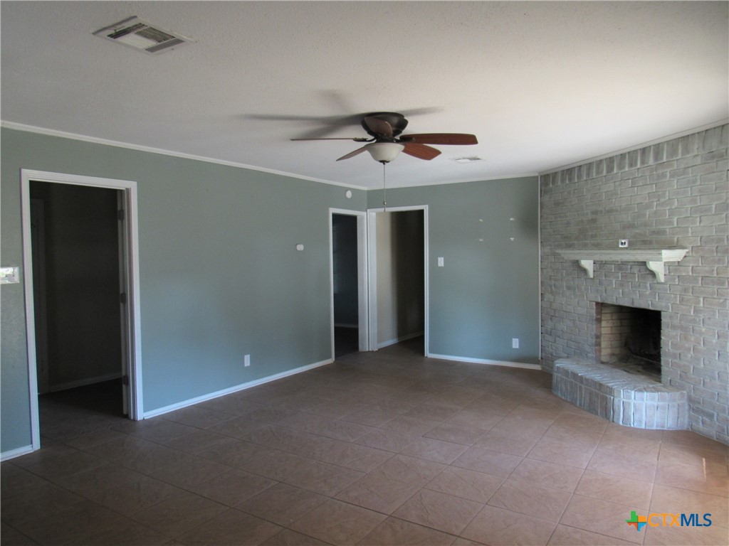 1325 Paseo Del Cobre Temple, TX 76502 - Photo 4 of 15 en empty room with ceiling fan and window