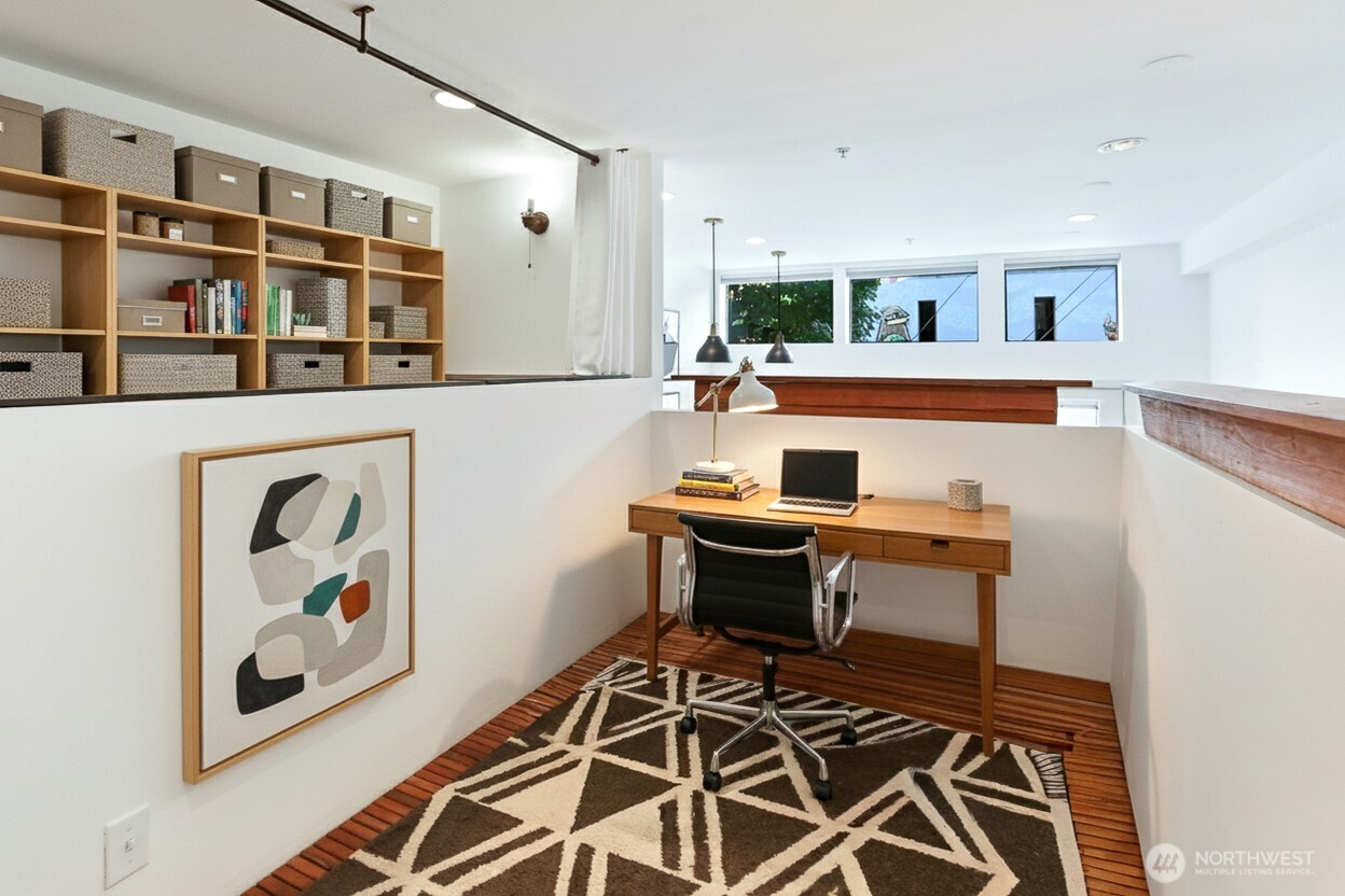 3604 Palatine Avenue North Seattle, WA 98103 - Photo 12 of 29 a workspace with wooden floor and white walls
