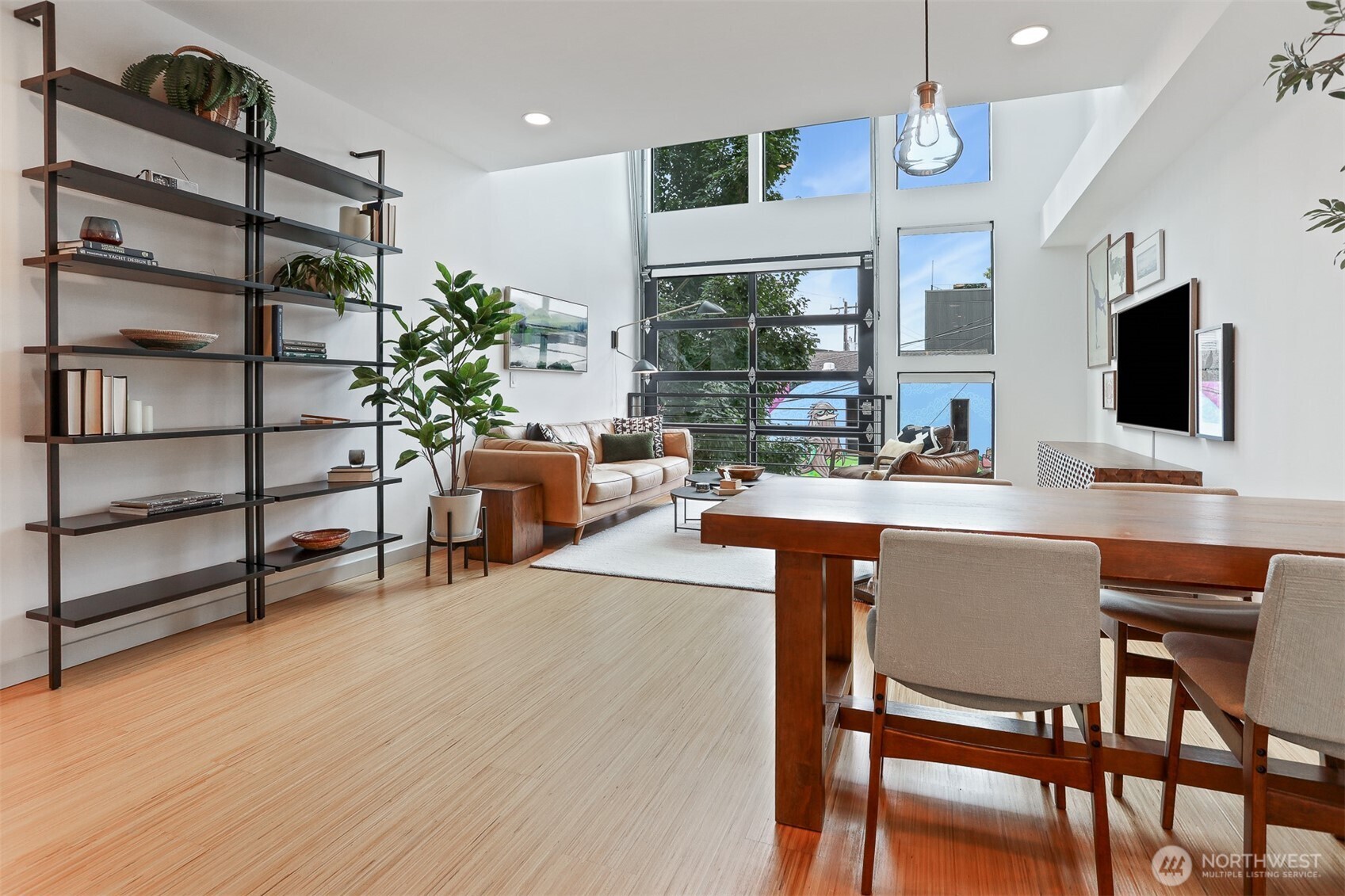 3604 Palatine Avenue North Seattle, WA 98103 - Photo 15 of 29 a dining room with furniture and a flat screen tv