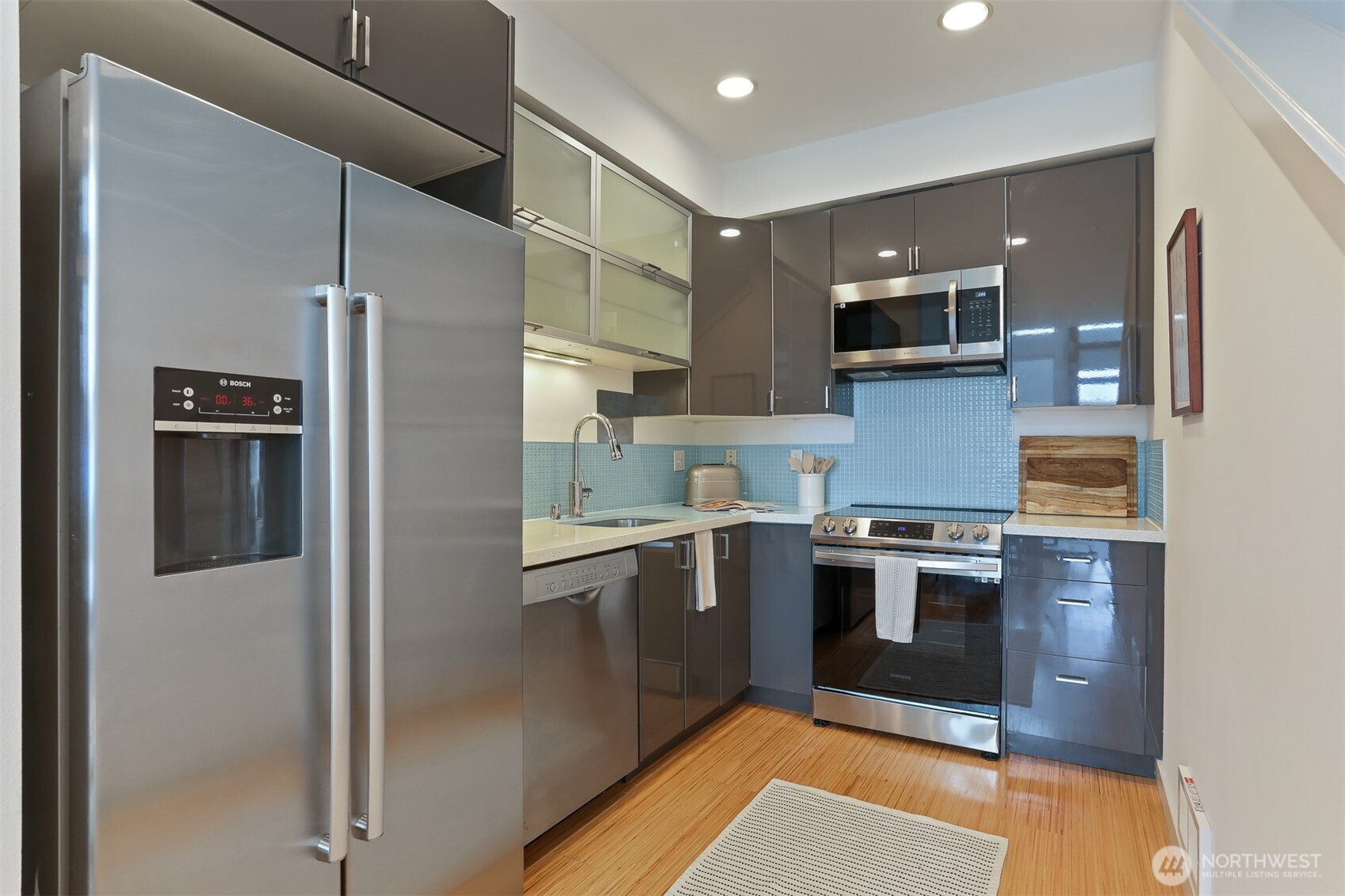 3604 Palatine Avenue North Seattle, WA 98103 - Photo 17 of 29 a kitchen with stainless steel appliances granite countertop a refrigerator and a stove top oven