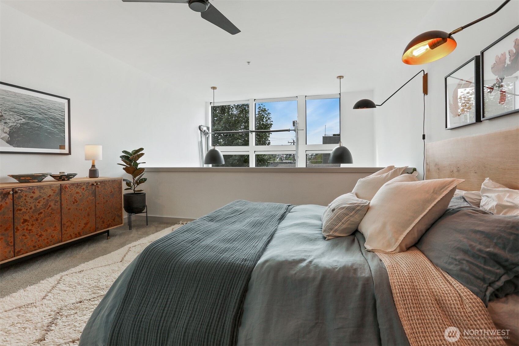 3604 Palatine Avenue North Seattle, WA 98103 - Photo 19 of 29 a bedroom with a bed and ceiling fan