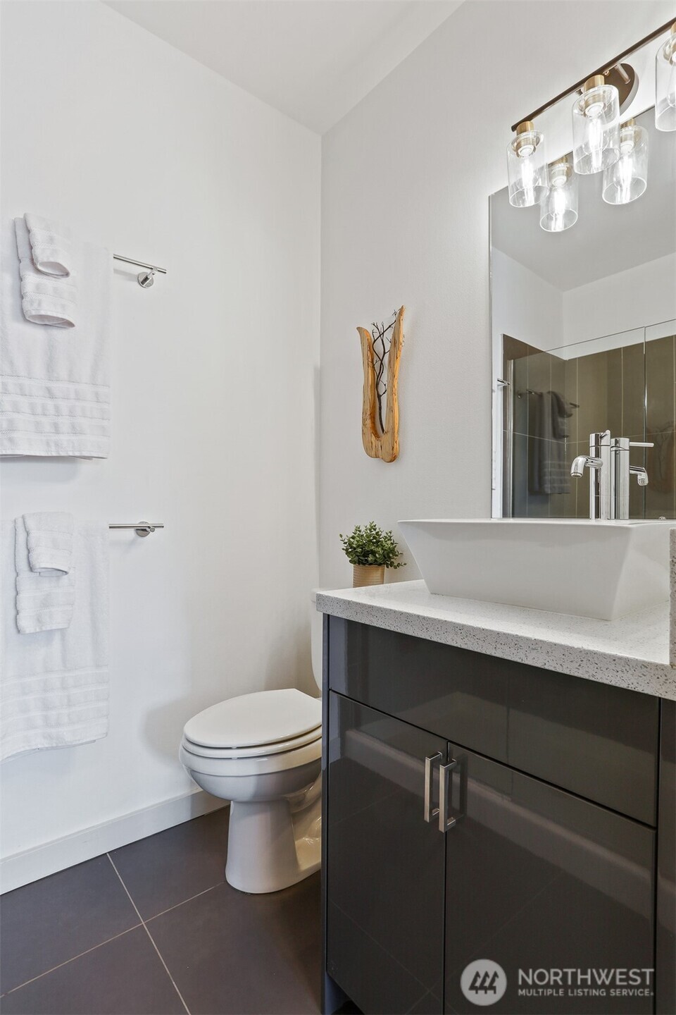 3604 Palatine Avenue North Seattle, WA 98103 - Photo 22 of 29 a bathroom with a toilet sink and mirror