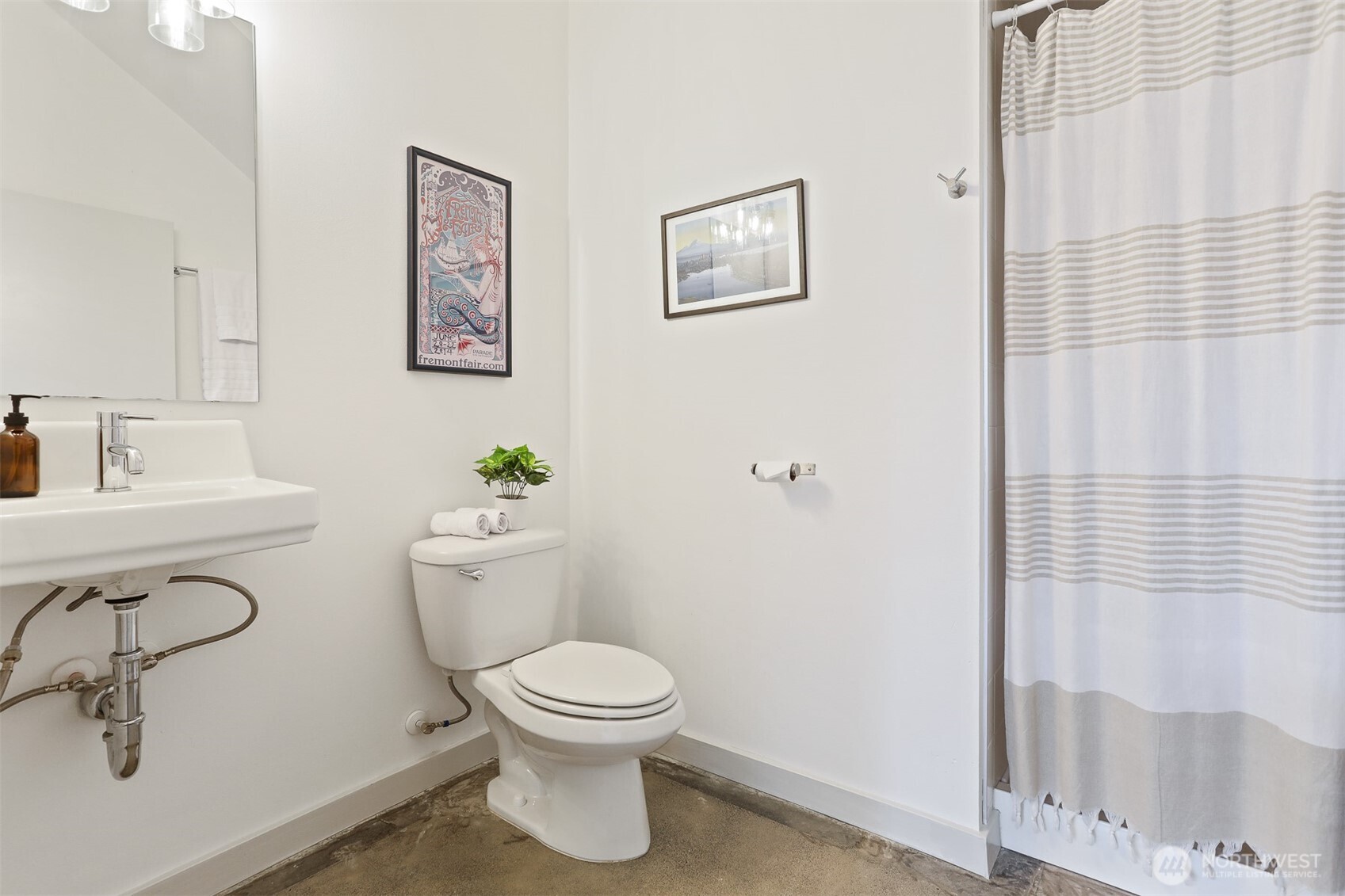 3604 Palatine Avenue North Seattle, WA 98103 - Photo 9 of 29 a white toilet sitting next to a bathroom sink