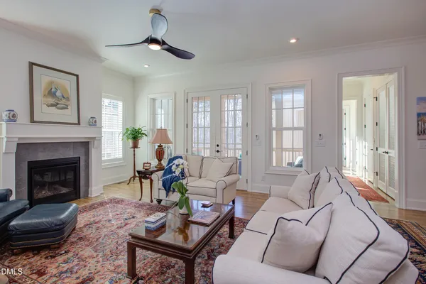 a living room with furniture a window and a fireplace