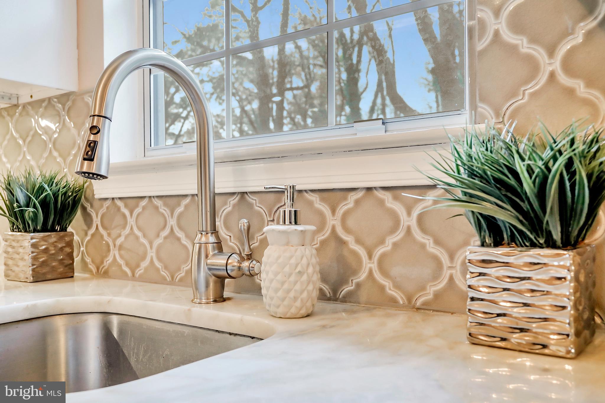 433 Broadwater Road Arnold, MD 21012 - Photo 28 of 46 Gleaming Quartz Countertop & Beautiful Backsplash
