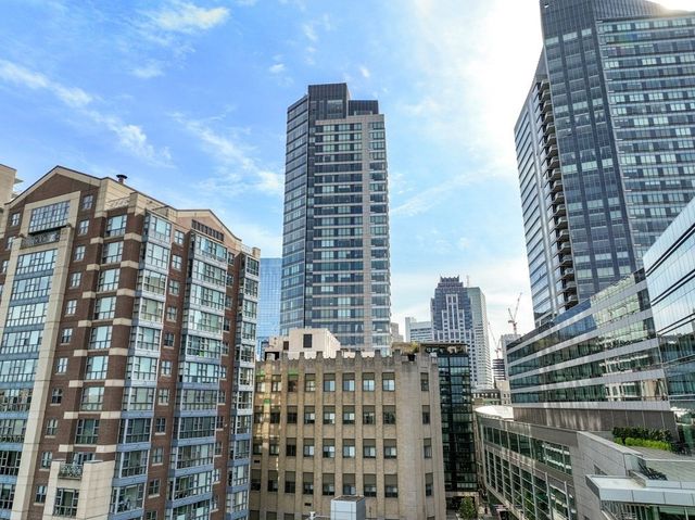 a view of a city with tall buildings