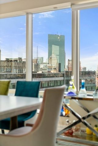 a view of swimming pool with outdoor seating