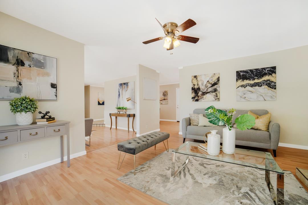 835 Fillippelli Drive Gilroy, CA 95020 - Photo 12 of 45 a living room with furniture and a chandelier