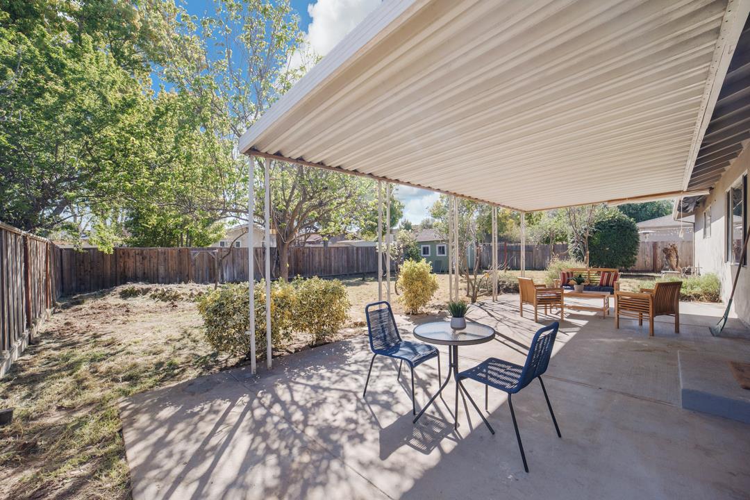 835 Fillippelli Drive Gilroy, CA 95020 - Photo 30 of 45 a view of a patio with a table and chairs under an umbrella