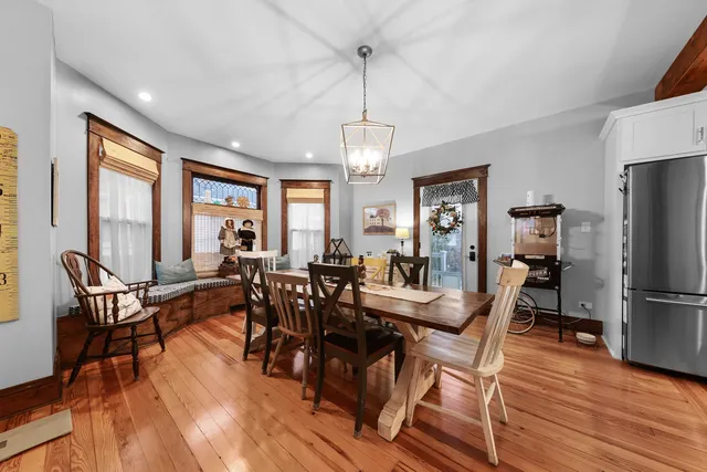 a view of a dining room with furniture window and wooden floor
