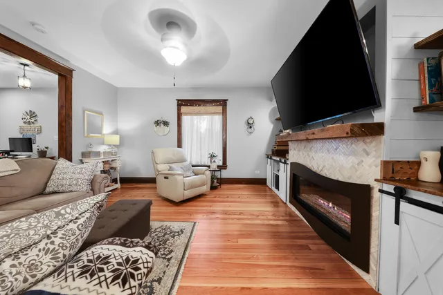 a living room with furniture and a fireplace
