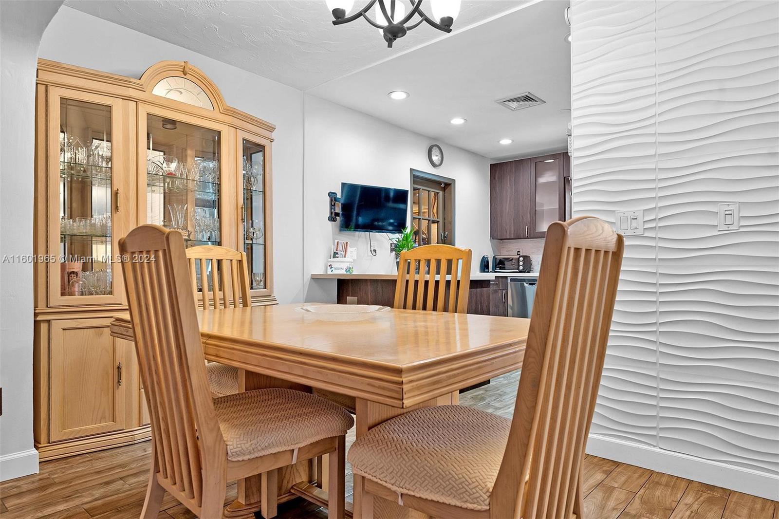 23 Southwest 8th Street Hallandale Beach, FL 33009 - Photo 10 of 23 a dining room with furniture and window