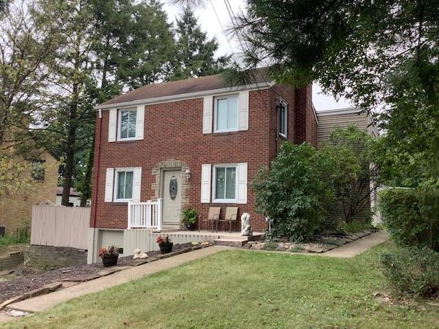8180 Peebles Road Pittsburgh, PA 15237 - Photo 1 of 24 a front view of a house with a yard and trees
