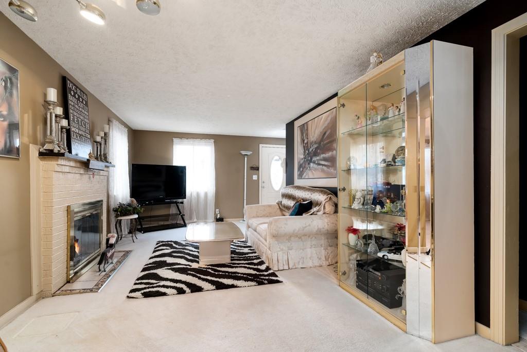 8180 Peebles Road Pittsburgh, PA 15237 - Photo 2 of 24 a room with furniture a flat screen tv and a window