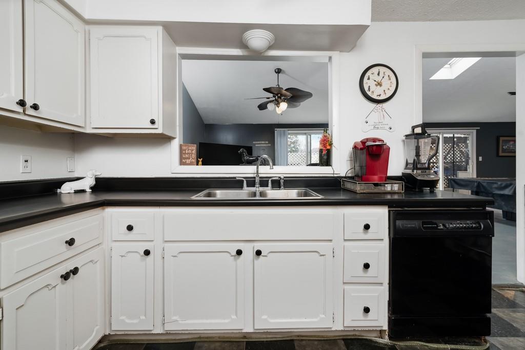 8180 Peebles Road Pittsburgh, PA 15237 - Photo 11 of 24 a kitchen with white cabinets and clock