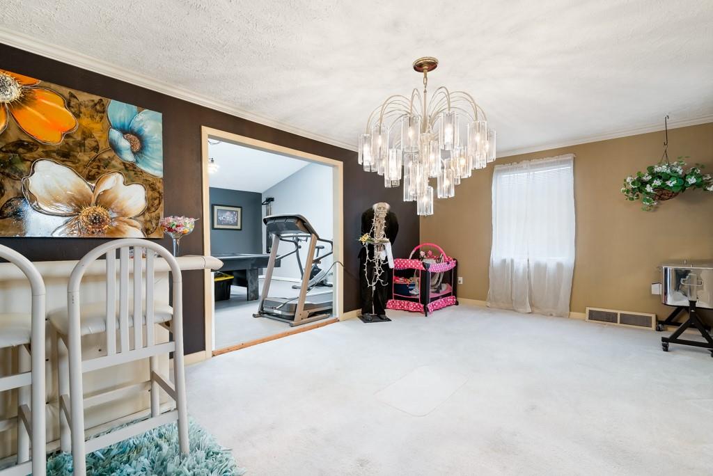 8180 Peebles Road Pittsburgh, PA 15237 - Photo 5 of 24 a view of a room with furniture and chandelier