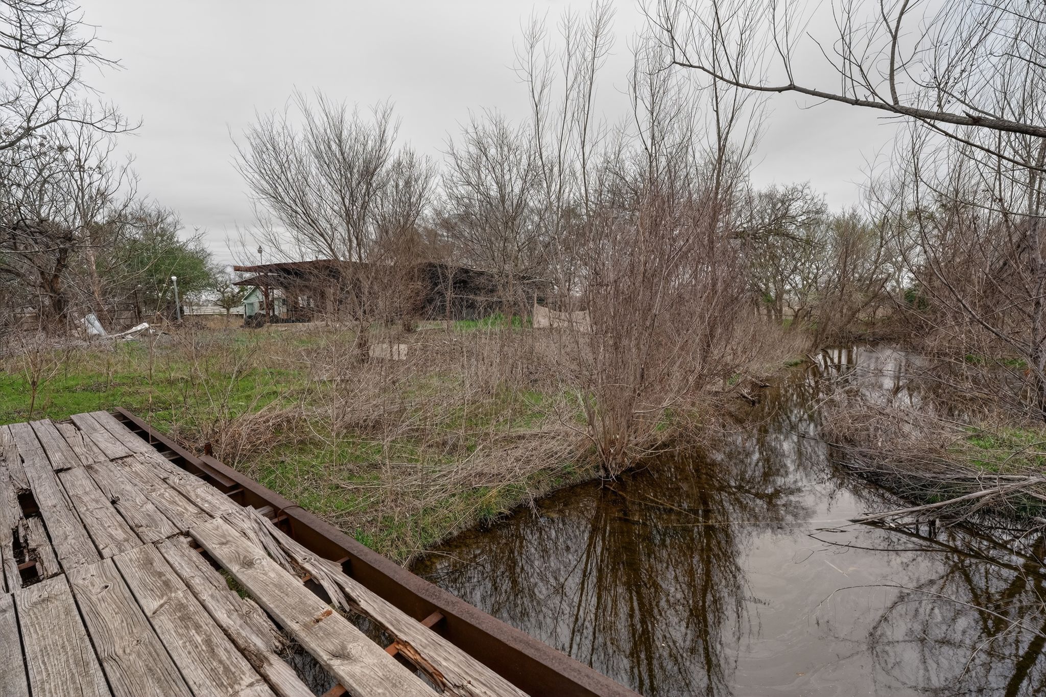 11223 Tom Sassman Road Austin, TX 78747 - Photo 21 of 40 Wooden deck featuring a water view
