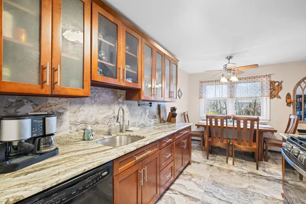 a kitchen with a sink and cabinets