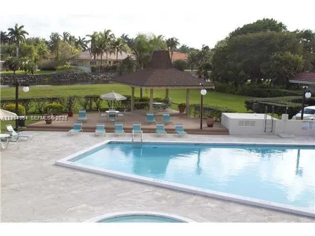 a view of a swimming pool with a patio