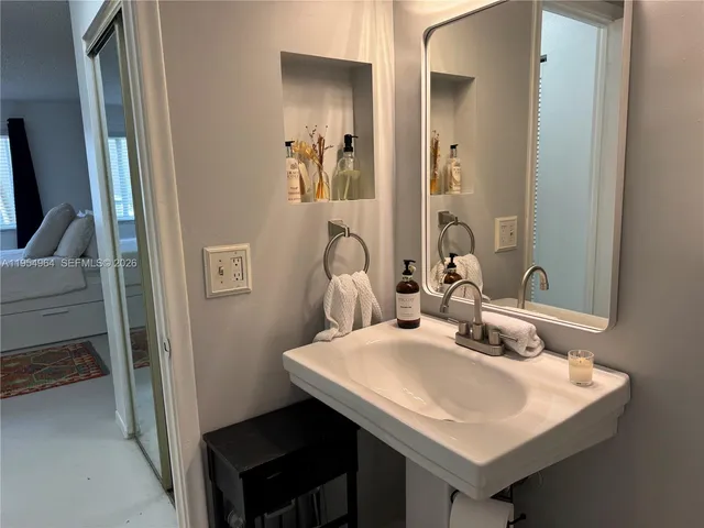 a bathroom with a sink and a mirror