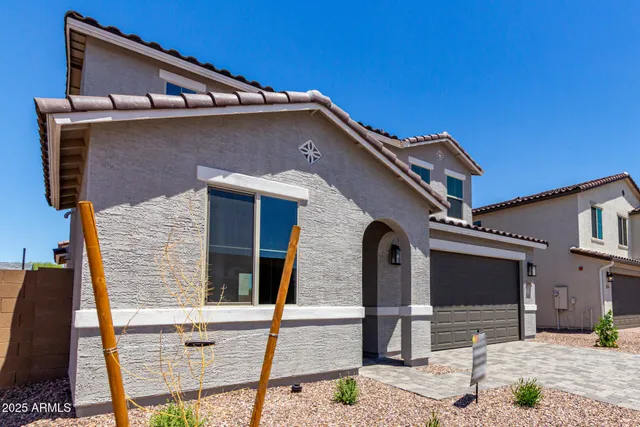 a front view of a house with parking
