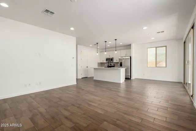 a view of an empty room and window