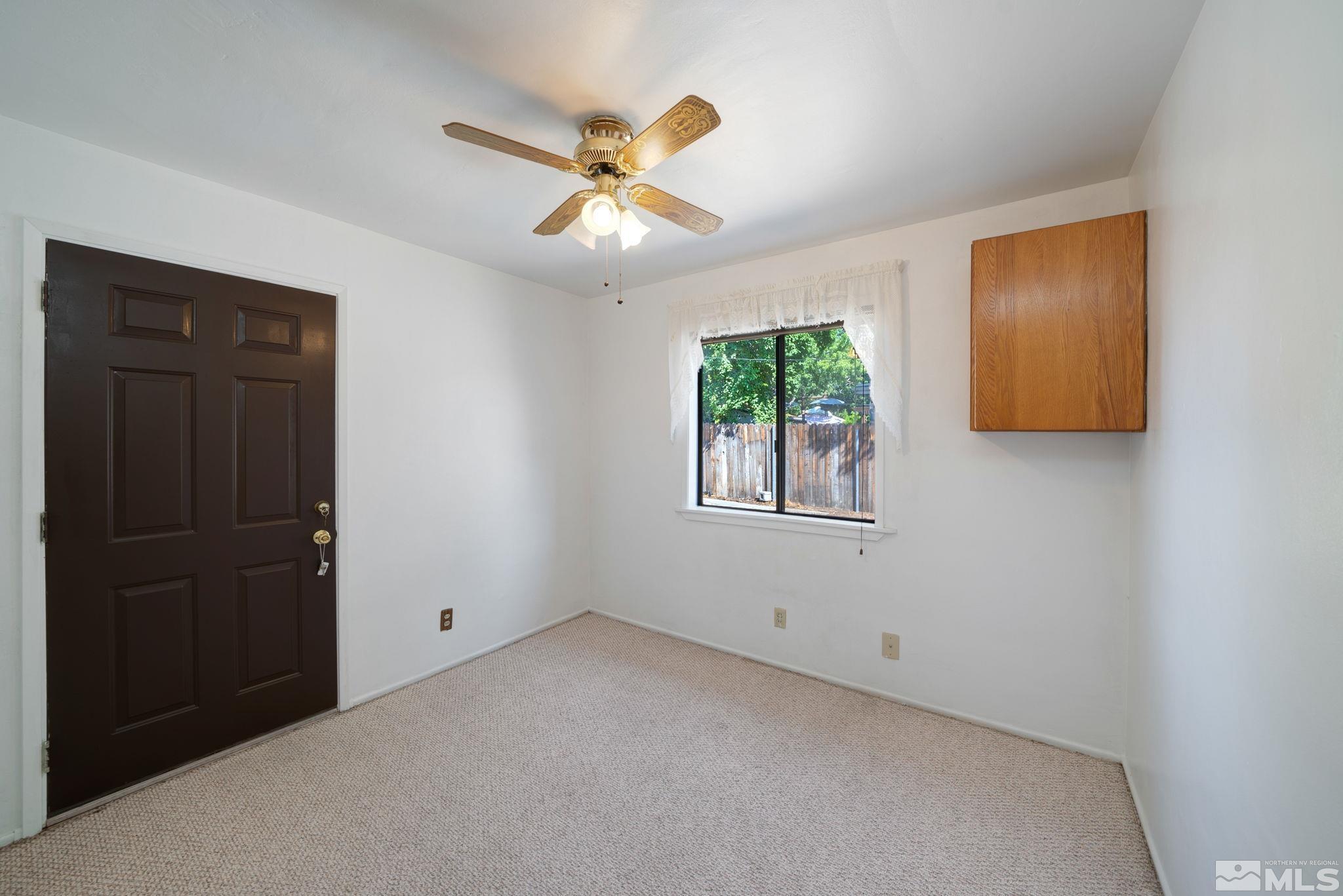 1535 Harvard Way Reno, NV 89502 - Photo 16 of 26 an empty room with windows and fan