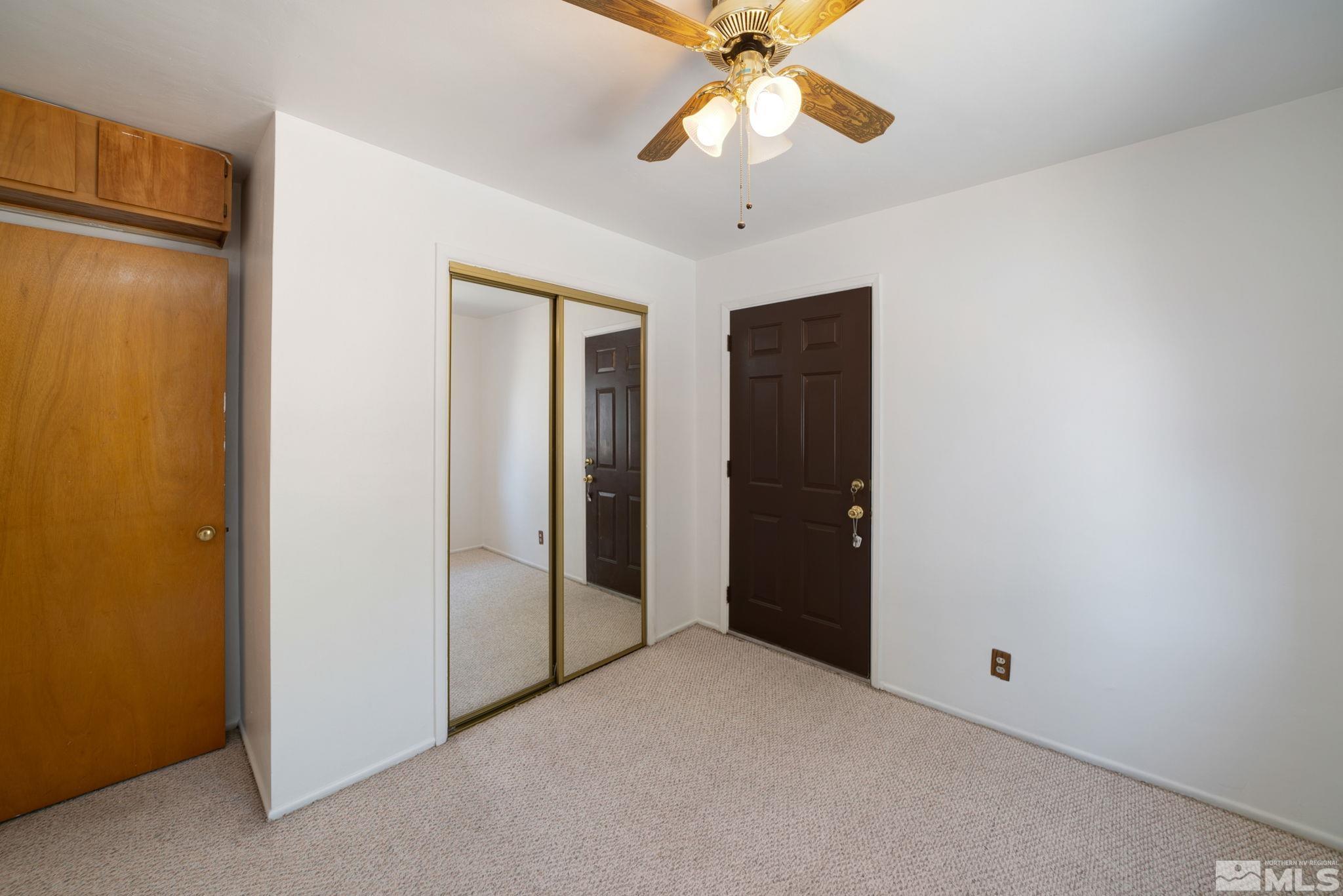 1535 Harvard Way Reno, NV 89502 - Photo 17 of 26 an empty room with chandelier fan