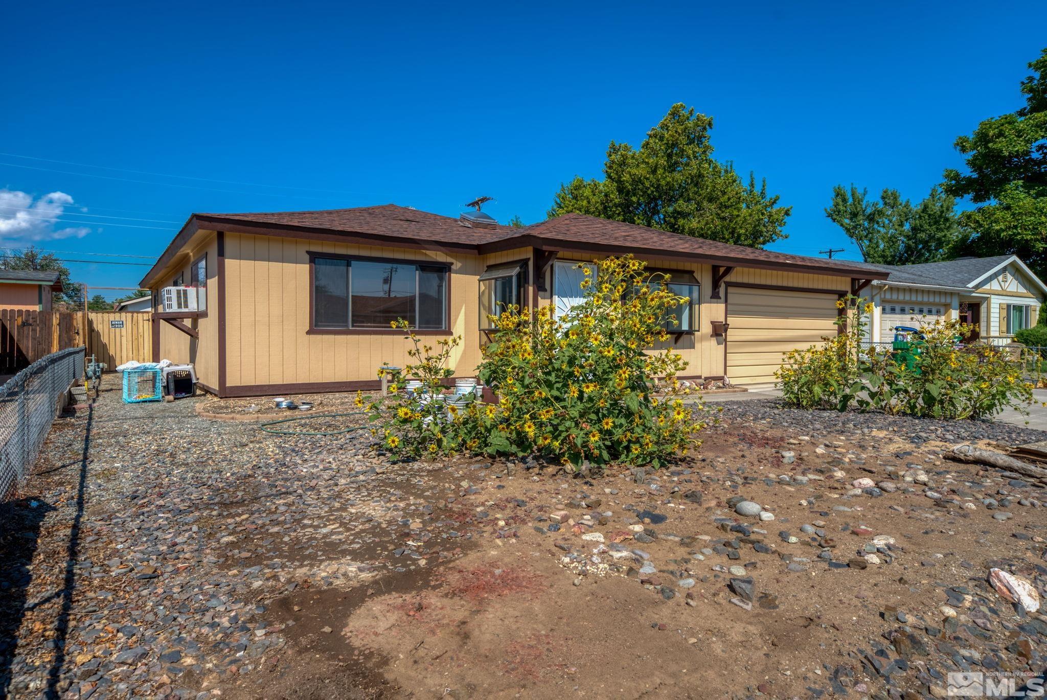1535 Harvard Way Reno, NV 89502 - Photo 2 of 26 a front view of a house with garden