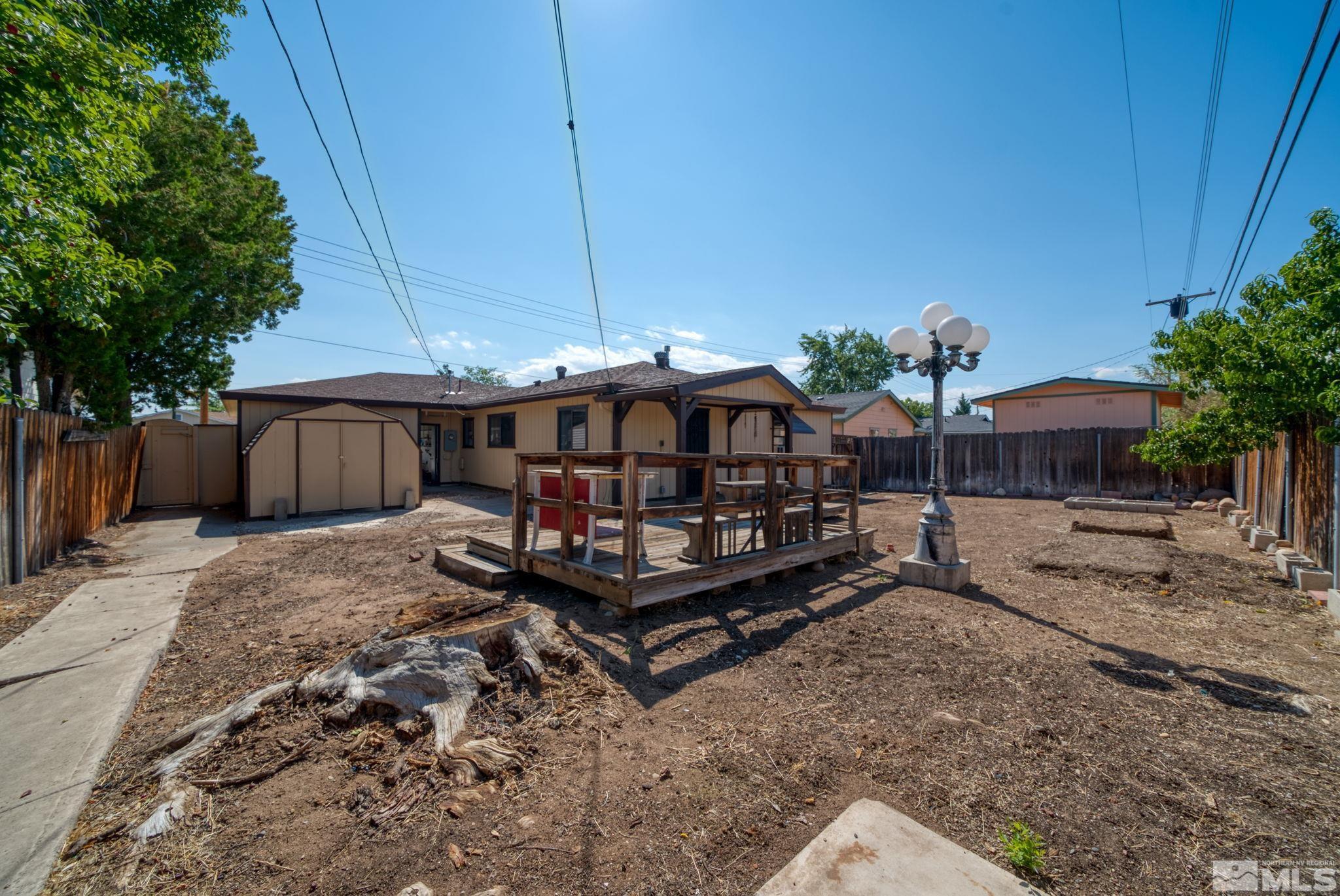 1535 Harvard Way Reno, NV 89502 - Photo 23 of 26 a view of a yard with a patio and a yard