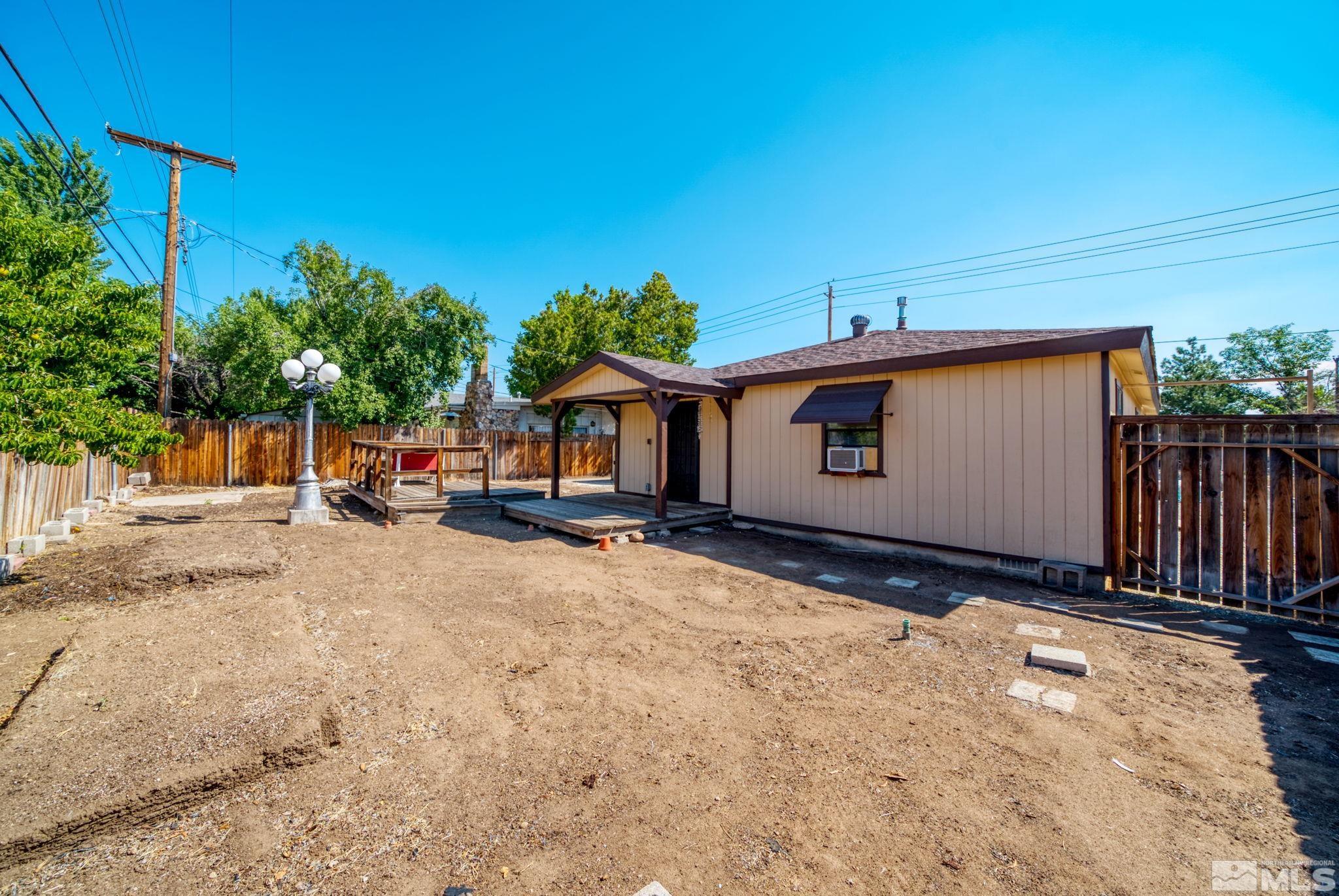 1535 Harvard Way Reno, NV 89502 - Photo 24 of 26 a front view of a house with a yard