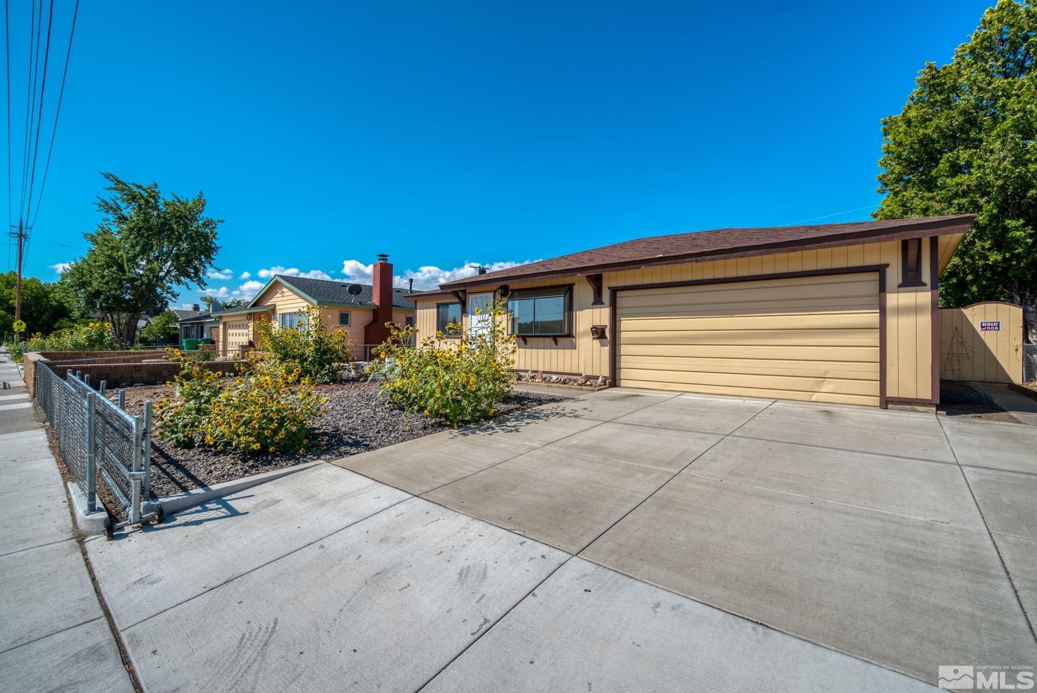 1535 Harvard Way Reno, NV 89502 - Photo 3 of 26 a front view of a house having yard