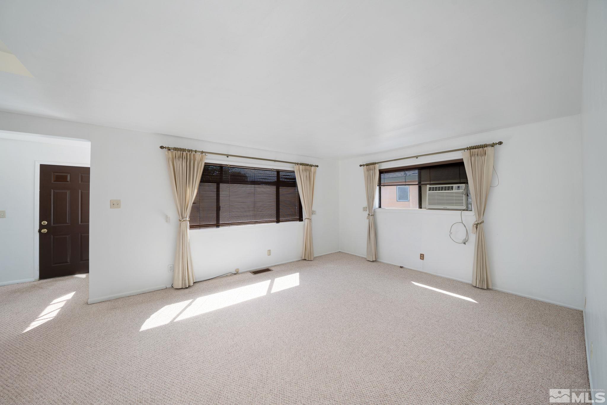 1535 Harvard Way Reno, NV 89502 - Photo 10 of 26 a view of an empty room with a window