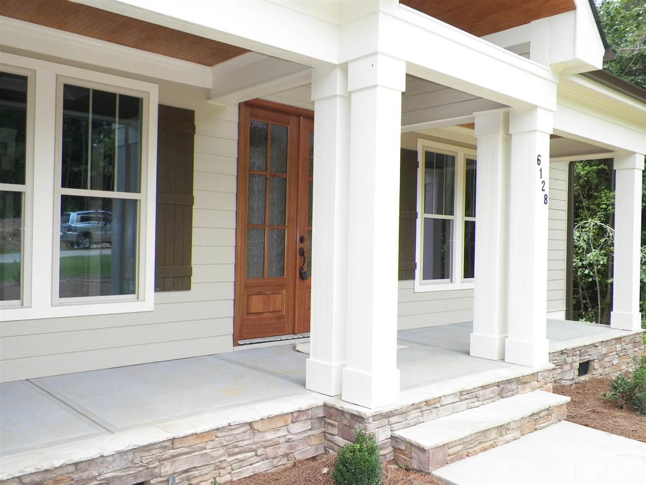 6128 Spring Branch Circle Raleigh, NC 27603 - Photo 2 of 25 a front view of a house with a yard