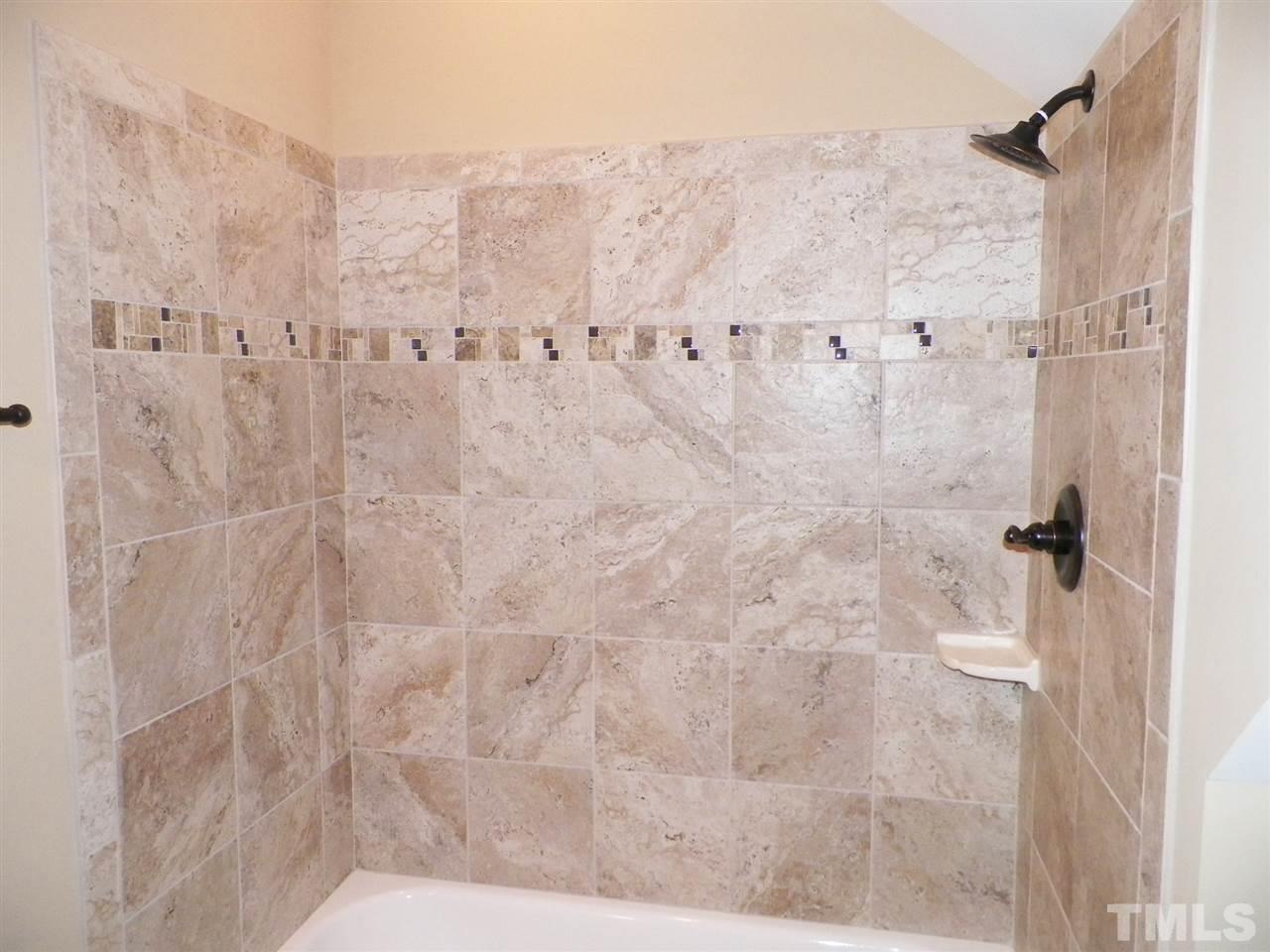 6128 Spring Branch Circle Raleigh, NC 27603 - Photo 17 of 25 a bathroom with a shower