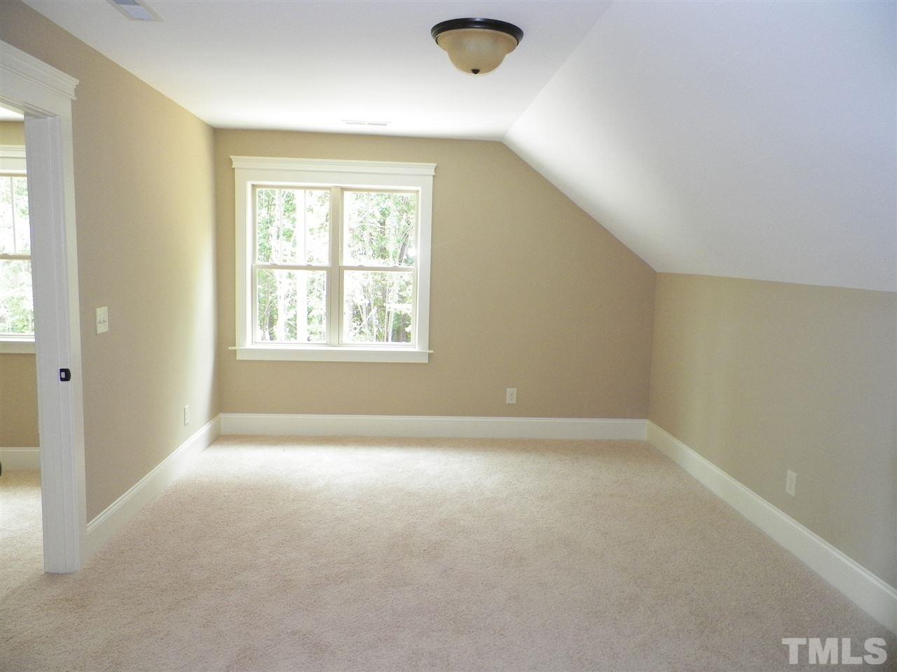 6128 Spring Branch Circle Raleigh, NC 27603 - Photo 19 of 25 an empty room with a empty space and windows
