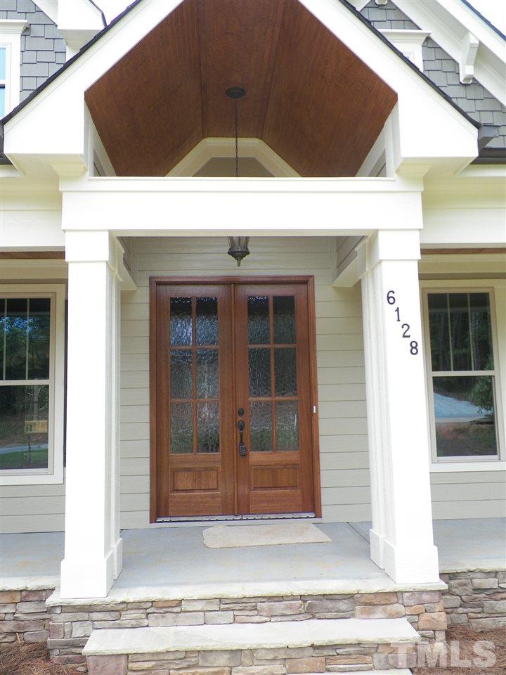 6128 Spring Branch Circle Raleigh, NC 27603 - Photo 24 of 25 a view of a entryway door front of house