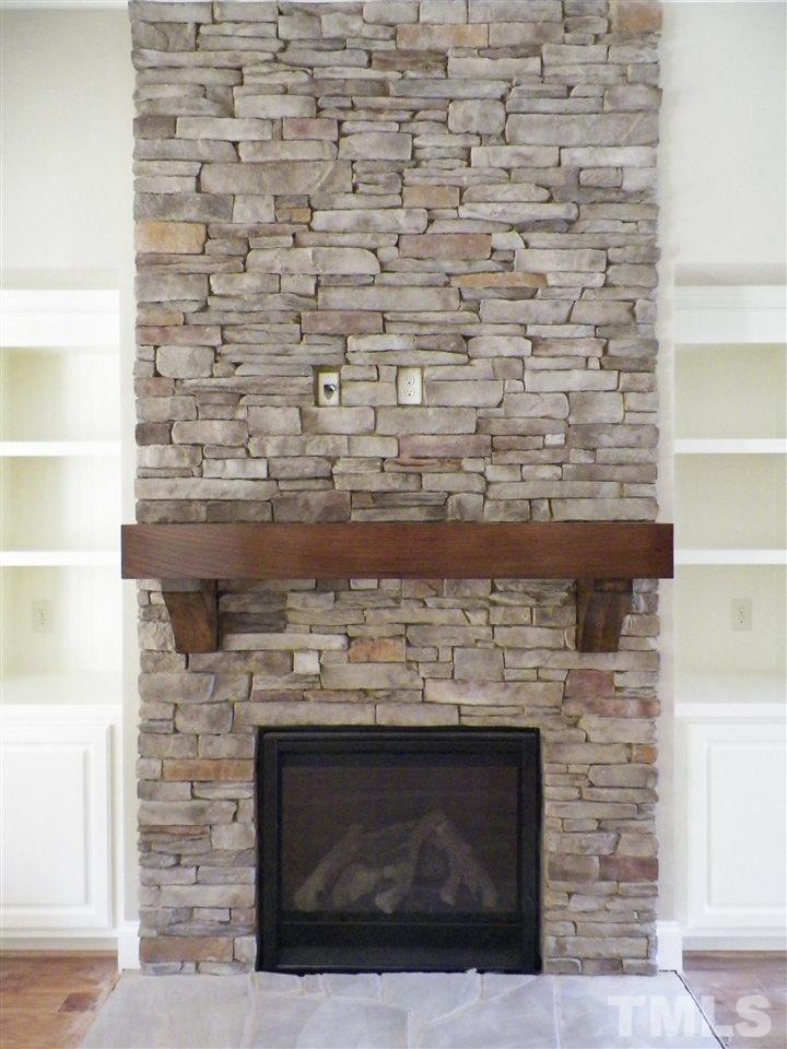 6128 Spring Branch Circle Raleigh, NC 27603 - Photo 10 of 25 a room with a fireplace