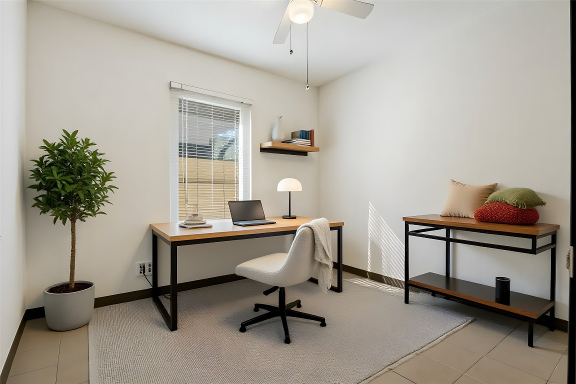 904 Plateau Circle, Unit A Austin, TX 78745 - Photo 13 of 26 a workspace with furniture and a potted plant