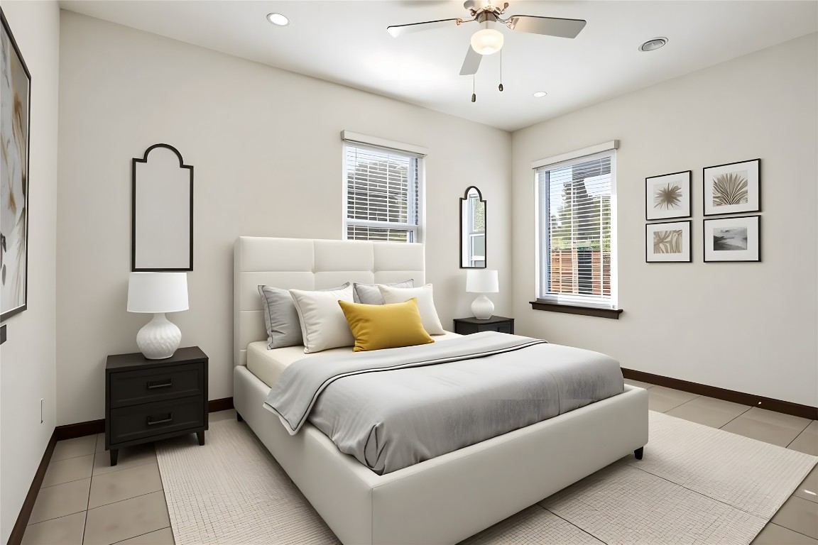 904 Plateau Circle, Unit A Austin, TX 78745 - Photo 15 of 26 a bedroom with bed and wooden floor