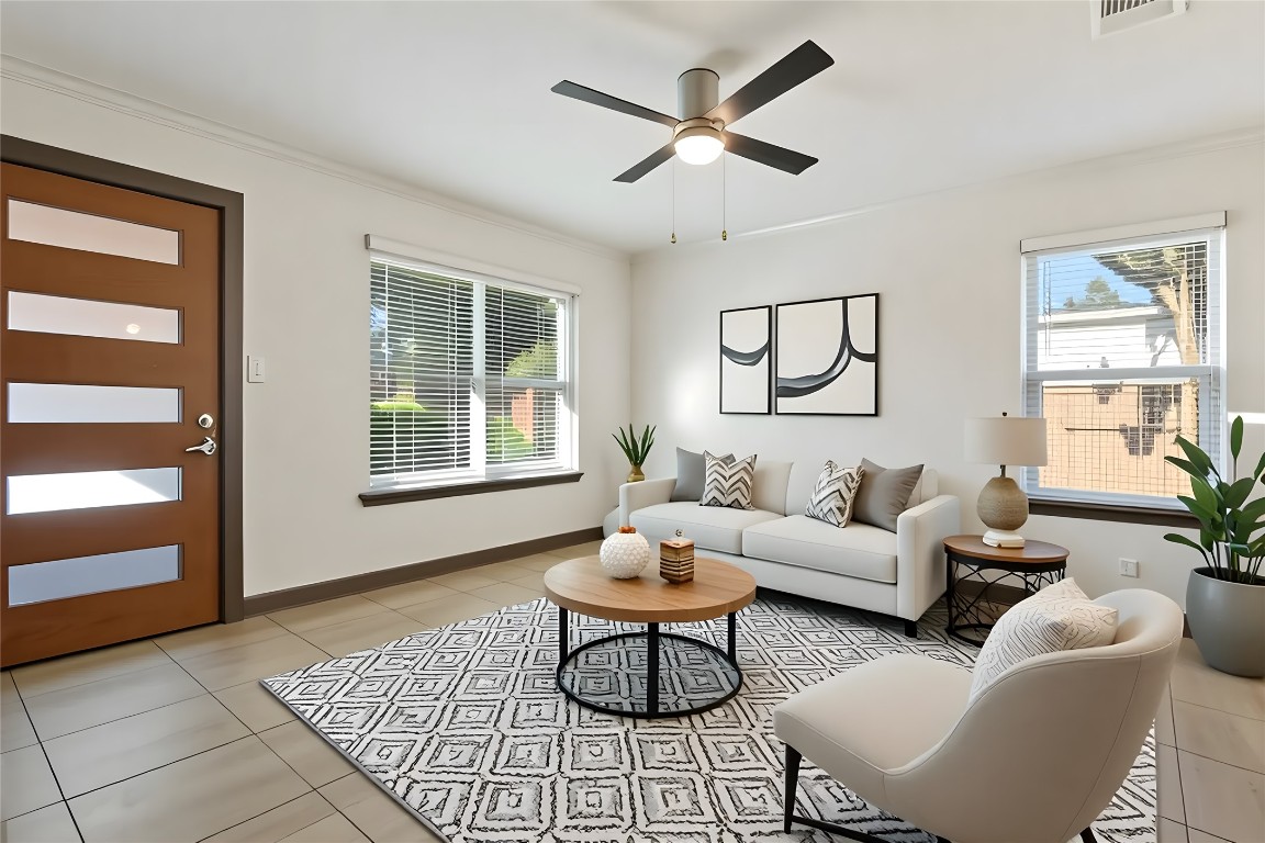 904 Plateau Circle, Unit A Austin, TX 78745 - Photo 4 of 26 a living room with furniture and a large window