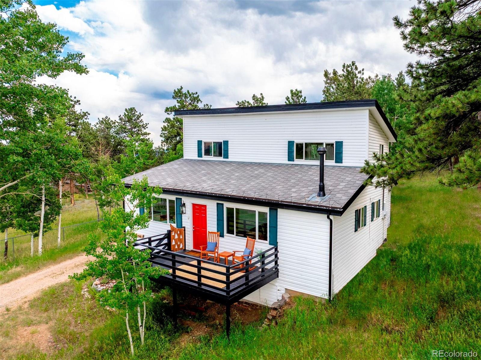a aerial view of a house with porch and wooden floor