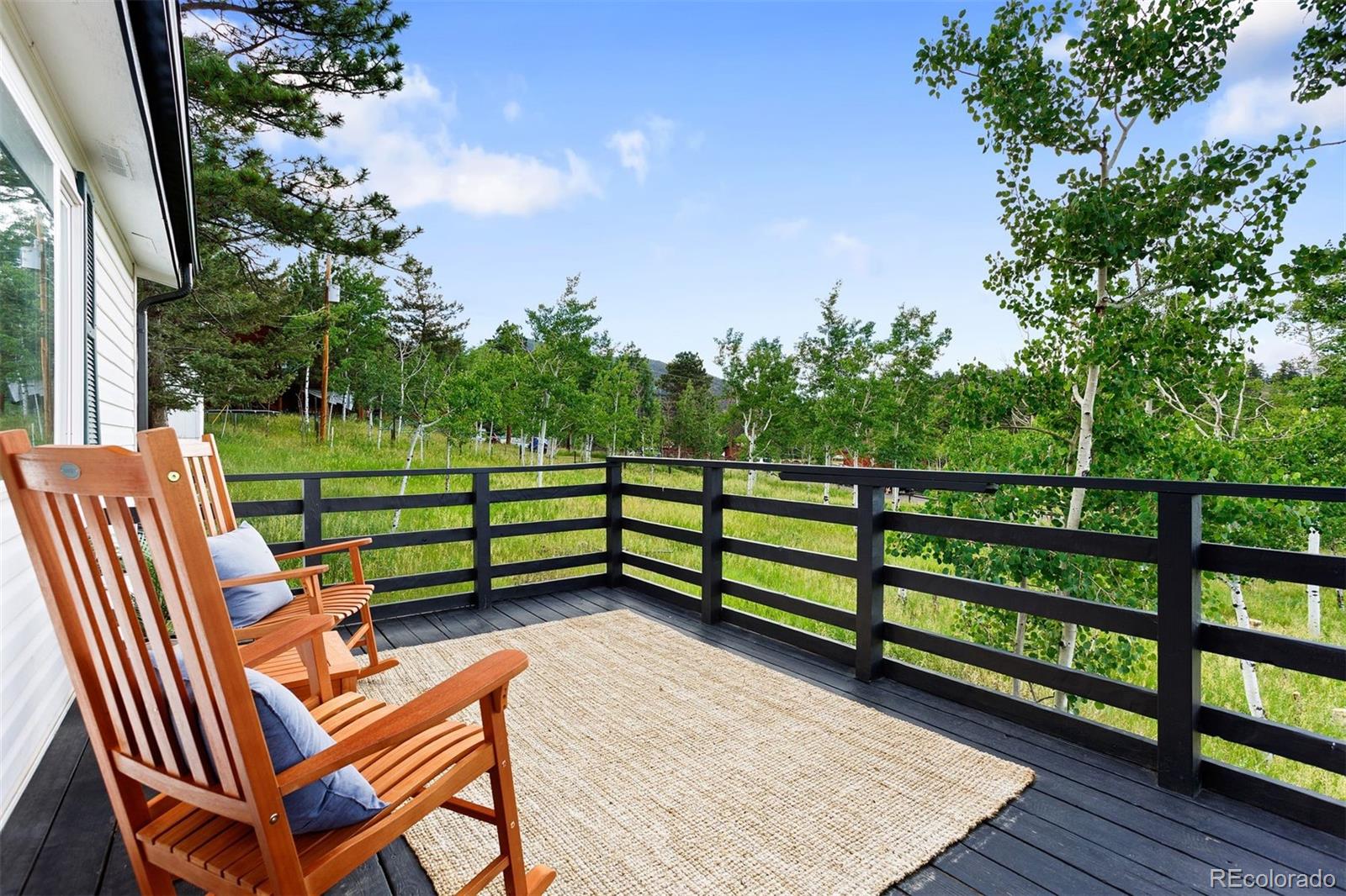 616 South Pine Drive Bailey, CO 80421 - Photo 14 of 50 a view of a bench in a backyard