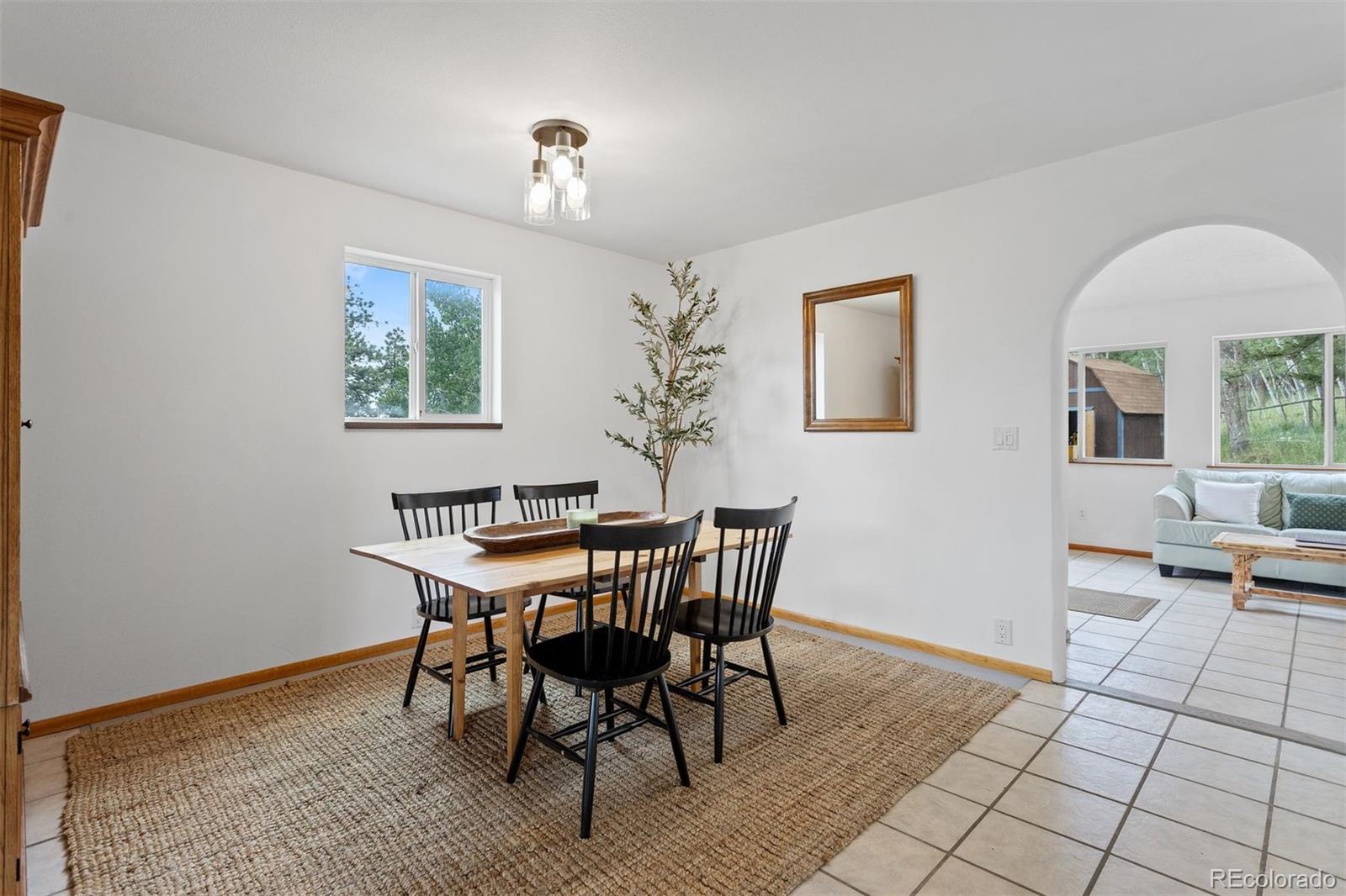 616 South Pine Drive Bailey, CO 80421 - Photo 17 of 50 a view of a dining room with furniture