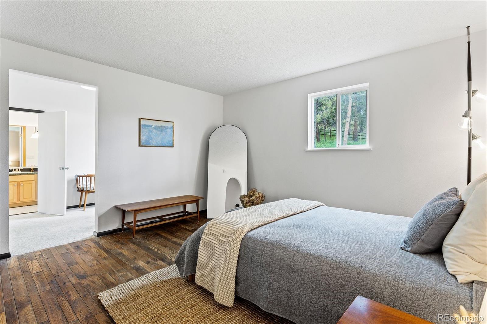 616 South Pine Drive Bailey, CO 80421 - Photo 24 of 50 a bedroom with bed and a window