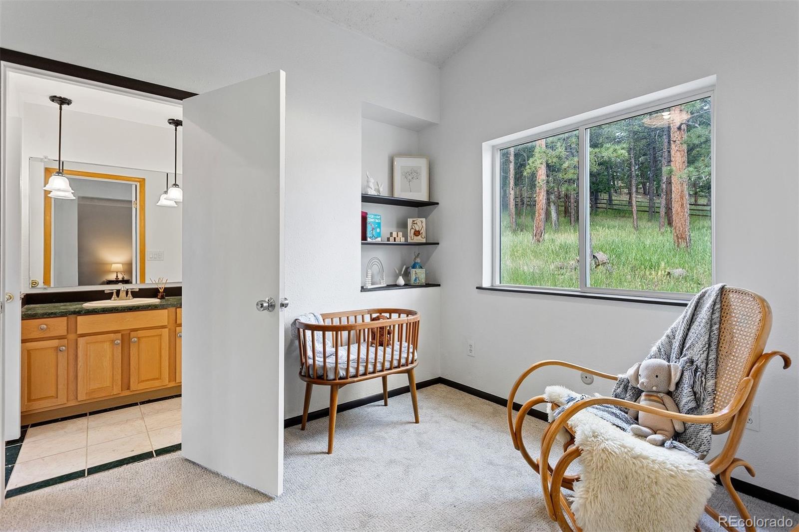 616 South Pine Drive Bailey, CO 80421 - Photo 26 of 50 a bedroom with furniture and a window